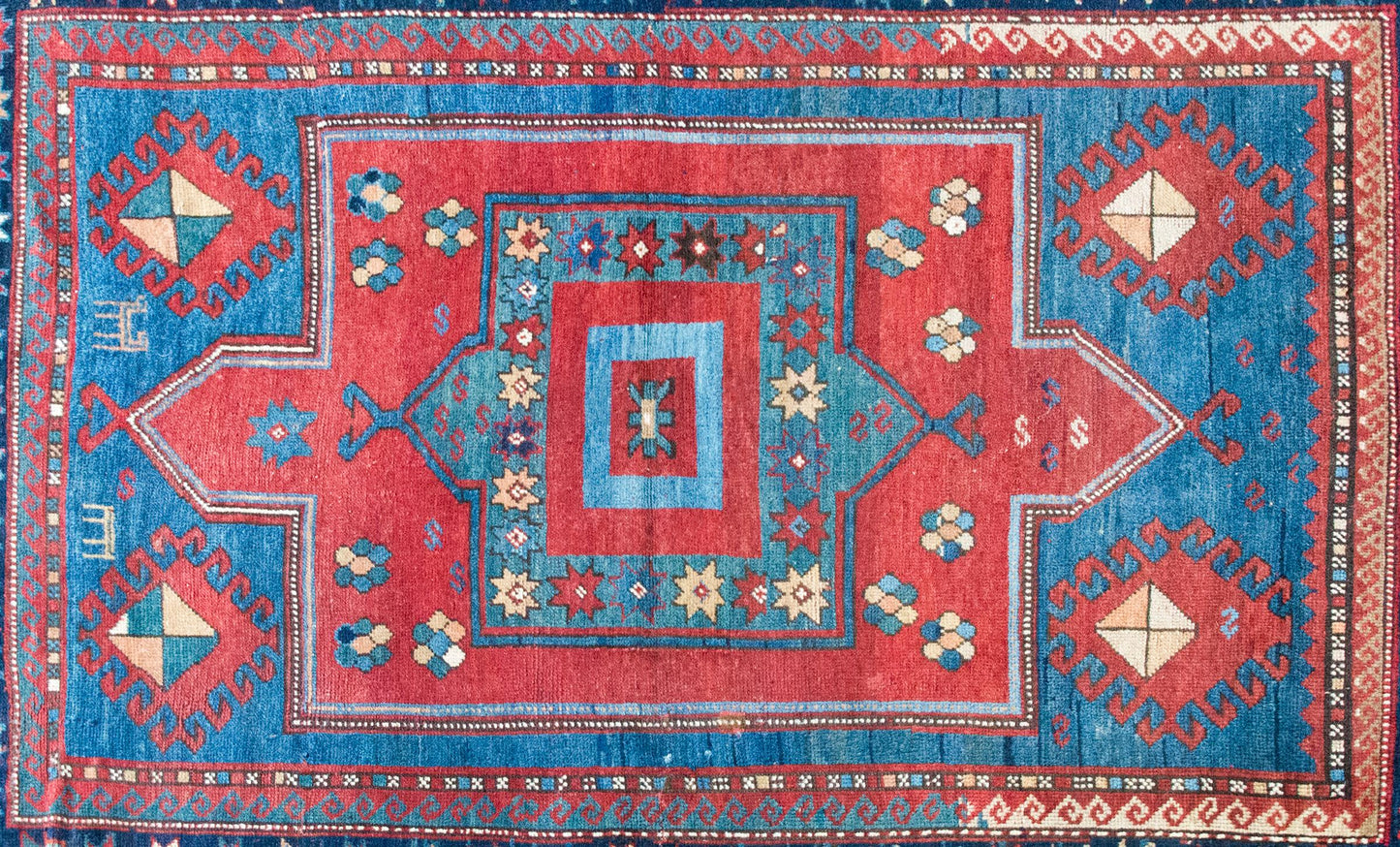 Early 20th Century Persian Kazak Rug For Sale