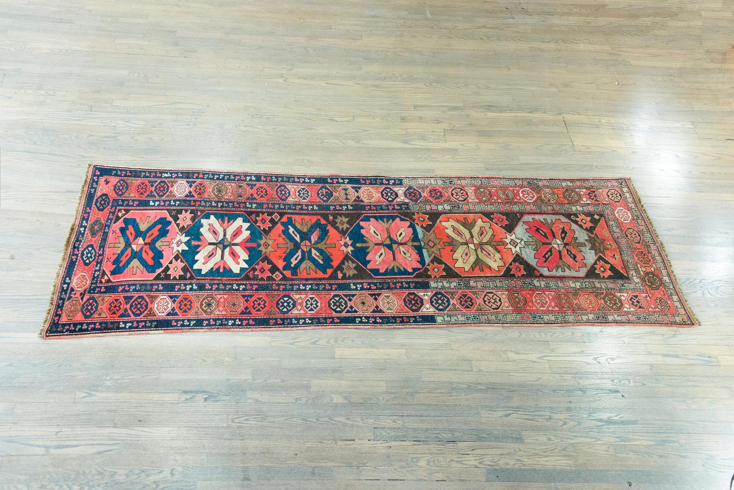 Early 20th Century Persian Kazak Rug For Sale