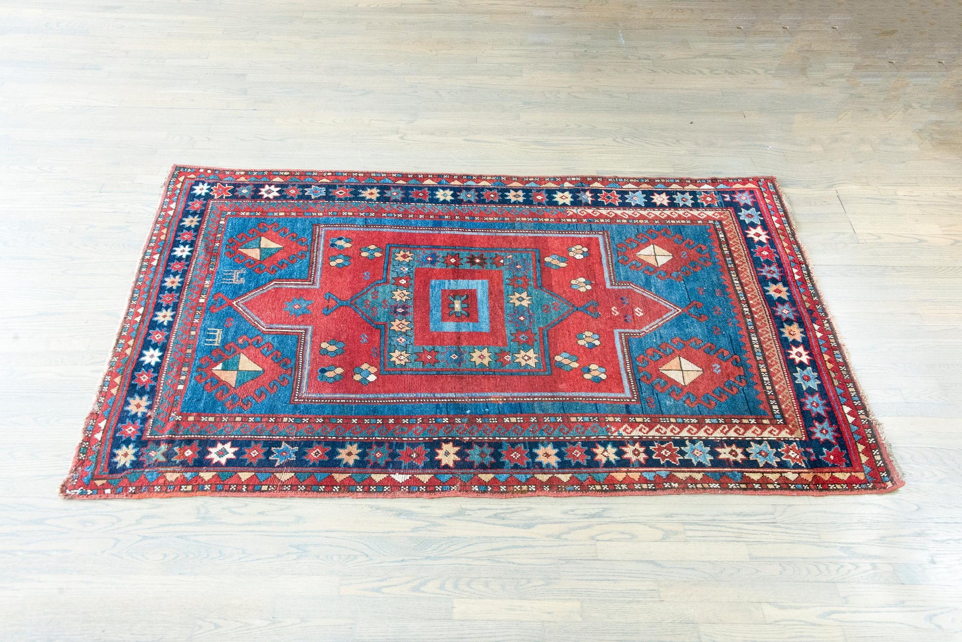 Early 20th Century Persian Kazak Rug For Sale