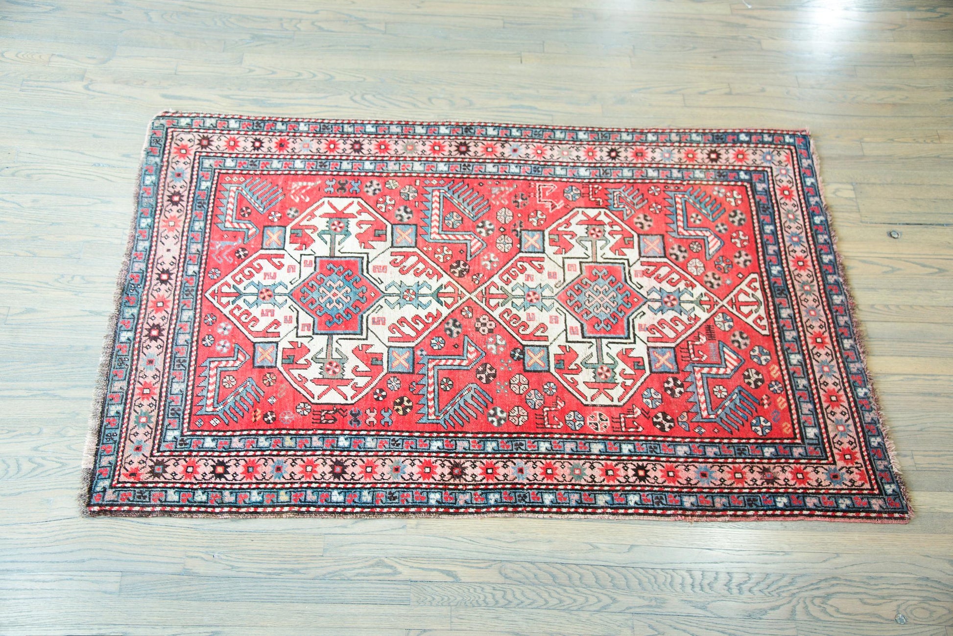Early 20th Century Persian Kazak Rug For Sale