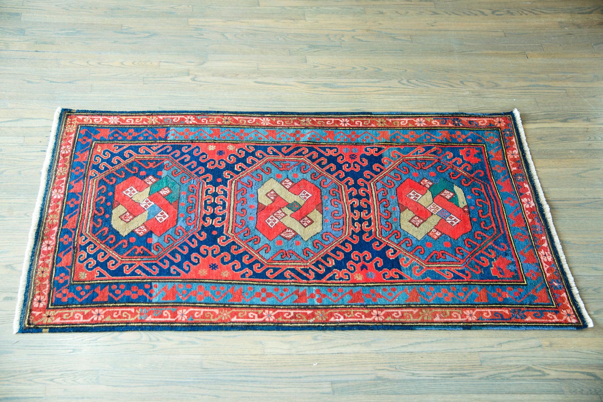 Early 20th Century Persian Kazak Rug For Sale